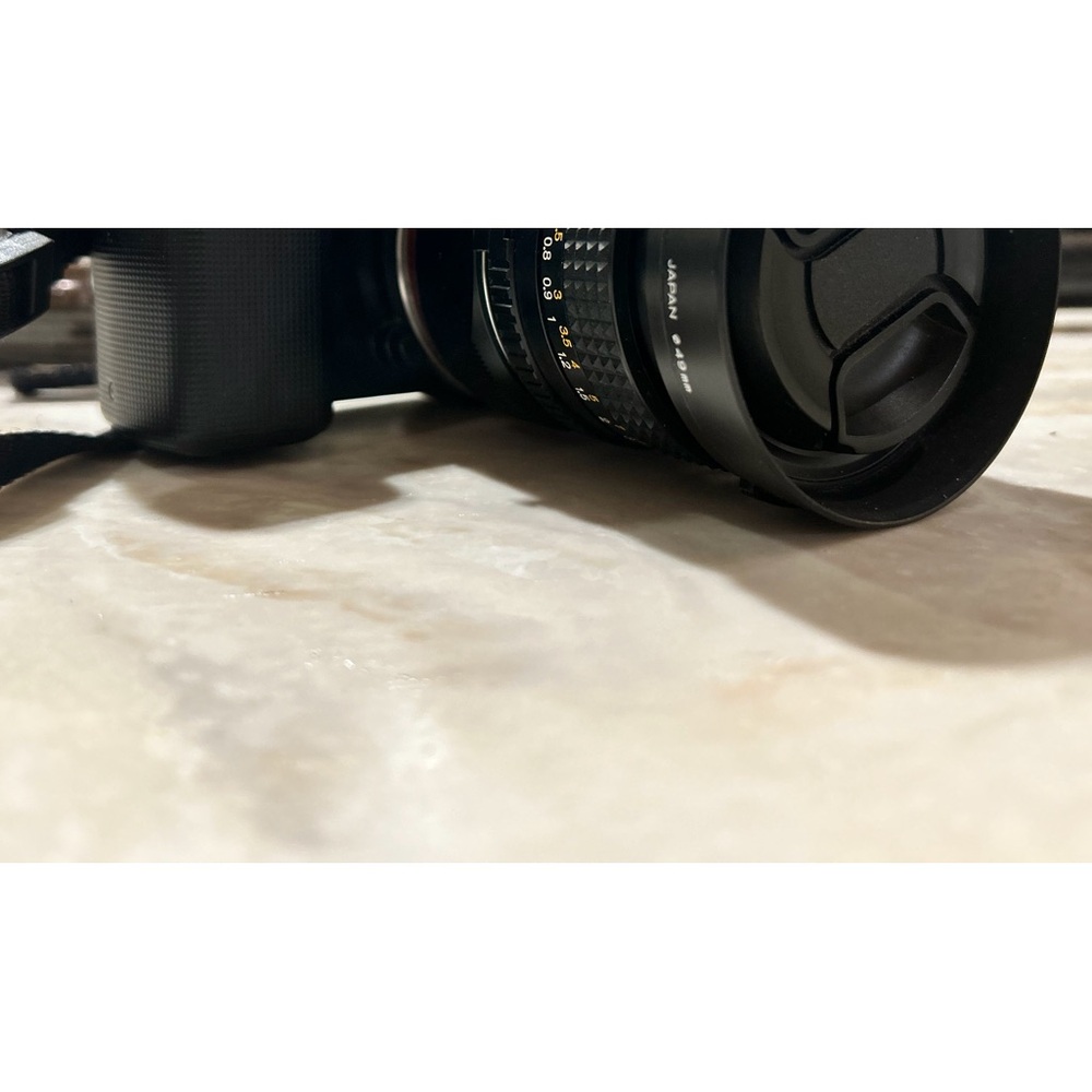 sony mirrorless APSC digital camera NEX 5 with adapter and Minolta lens.